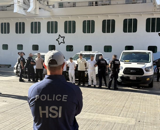 ICE/HSI officers with detained men at a port