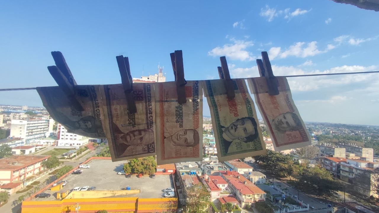 Cuban peso banknotes pegged on a clothesline over Havana